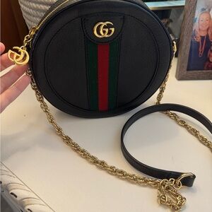 Gucci Black and Gold Round Crossbody Bag with Signature Stripe